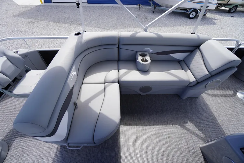 Slide: The Image of 2023 Bennington S 18 Fishing boat interior with gray seating and cup holders. - 20