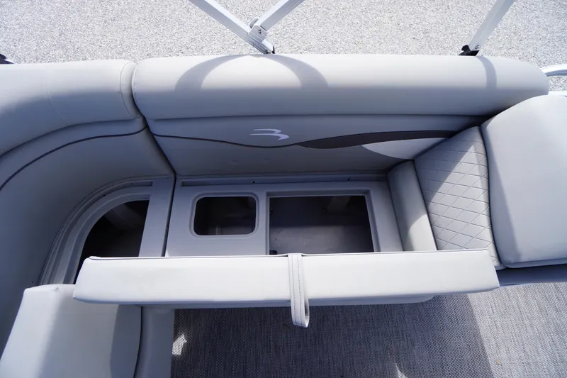 Slide: The Image of 2023 Bennington S 18 Fishing boat interior seating with storage compartments. - 23