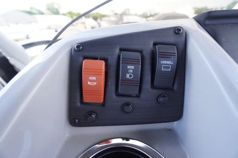Slide: The Image of Control panel of 2023 Bennington S 18 Fishing boat with horn, dock lights, and livewell switches. - 27