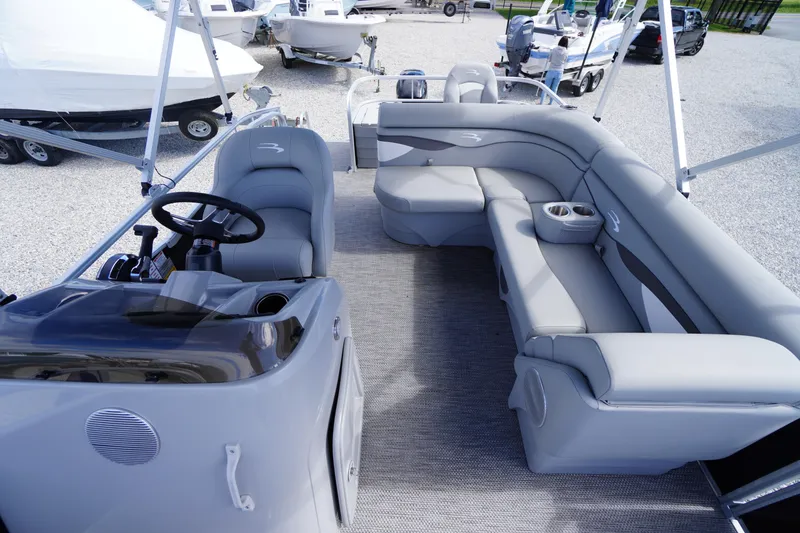 Slide: The Image of 2023 Bennington S 18 Fishing boat interior with gray seating and steering console. - 42