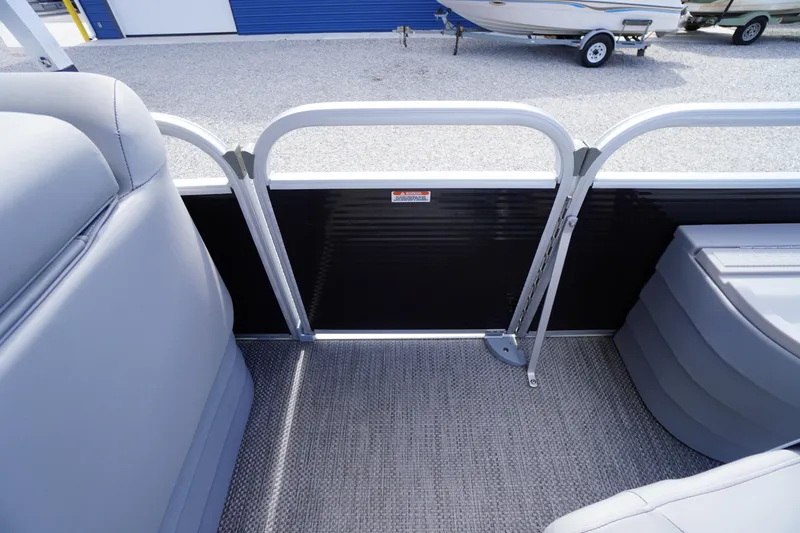 Slide: The Image of 2023 Bennington S 18 Fishing boat interior with gray seating and carpeted floor. - 43
