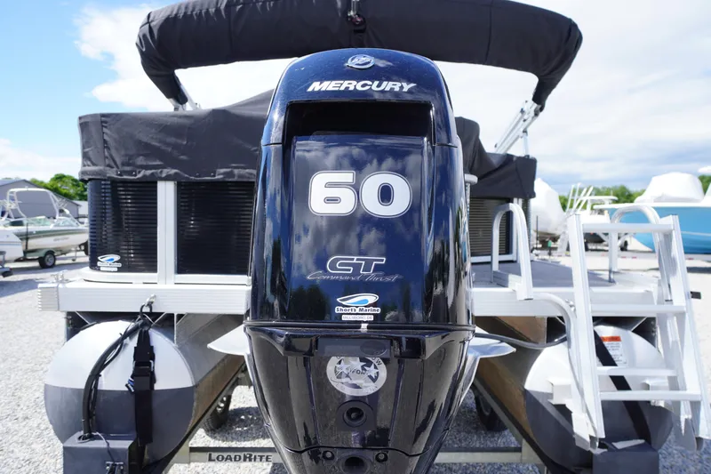 Slide: The Image of 2023 Bennington S 18 Fishing boat with Mercury 60 HP engine, parked outdoors. - 6