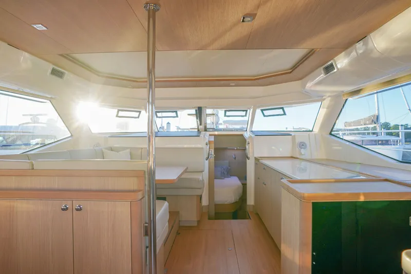 Slide: The Image of Luxurious interior of 2021 Aquila 44 Yacht with modern furnishings and ample natural light. - 5