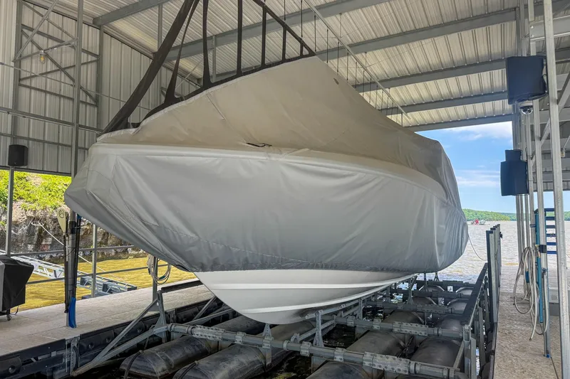 Slide: The Image of 2021 Boston Whaler 420 Outrage covered and docked in a sheltered marina. - 11