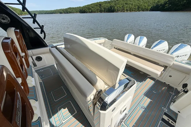 Slide: The Image of 2021 Boston Whaler 420 Outrage boat interior with seating and multiple outboard engines. - 24