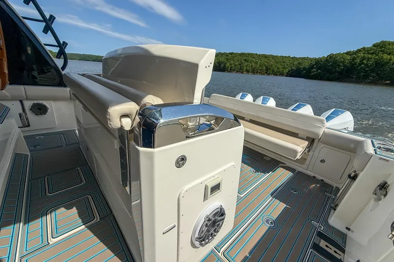 Slide: The Image of 2021 Boston Whaler 420 Outrage boat interior with seating and lake view. - 28