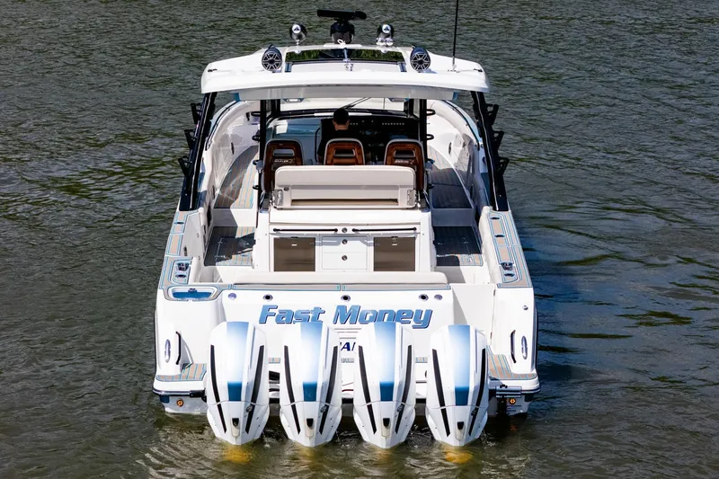 Slide: The Image of 2021 Boston Whaler 420 Outrage boat with quad engines on water. - 3