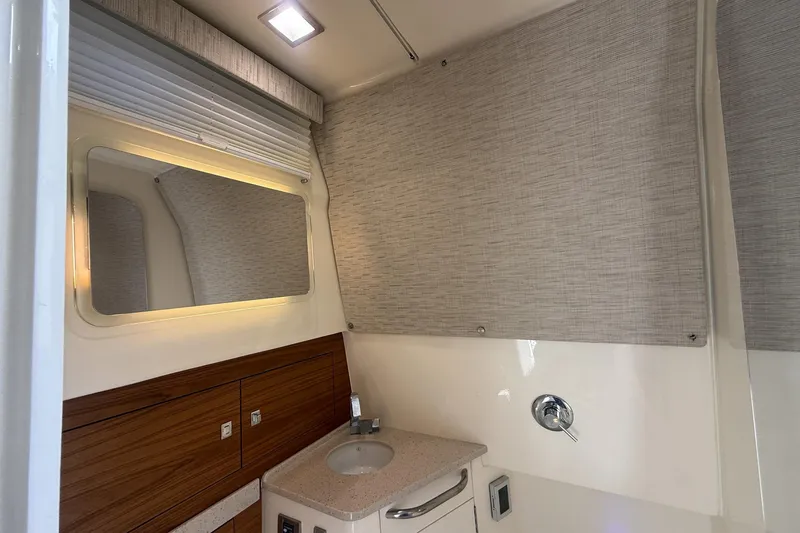 Slide: The Image of Luxurious bathroom interior of 2021 Boston Whaler 420 Outrage yacht with modern fixtures. - 33