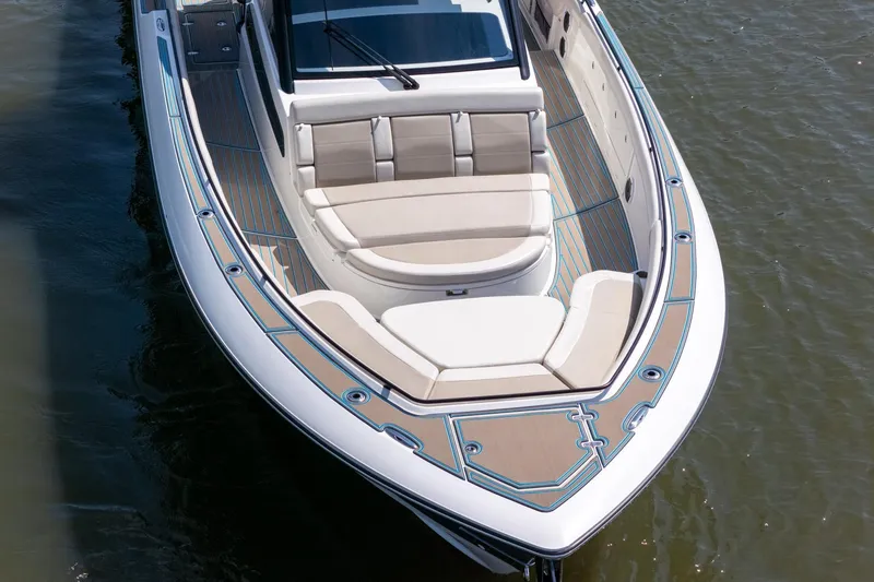 Slide: The Image of 2021 Boston Whaler 420 Outrage boat with spacious seating and elegant design on the water. - 8