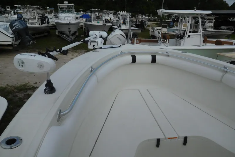 Slide: The Image of 2003 Hydra-Sports Vector 2800 CC boat with trolling motor, docked among other vessels. - 7