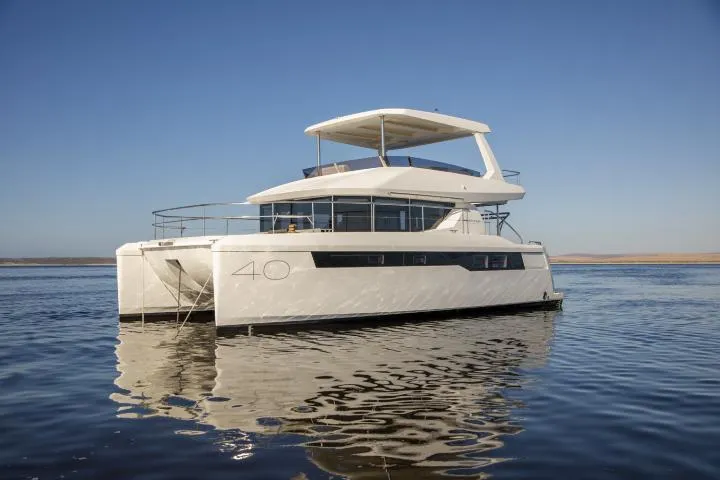 The Image of Manufacturer Provided Image: 2025 Leopard 40 Powercat yacht on calm water under clear blue sky. - 0
