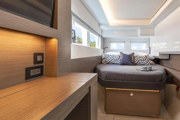 Slide: The Image of Manufacturer Provided Image: Luxurious cabin interior of 2025 Leopard 40 Powercat with modern design and cozy bedding. - 12