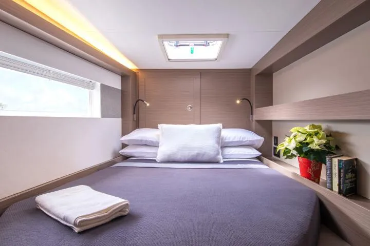 Slide: The Image of Manufacturer Provided Image: Luxurious cabin interior of 2025 Leopard 40 Powercat with cozy bed and modern decor. - 13