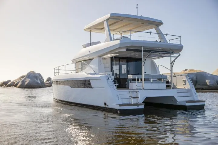 Slide: The Image of Manufacturer Provided Image: 2025 Leopard 40 Powercat yacht on calm water, showcasing sleek design and modern features. - 2