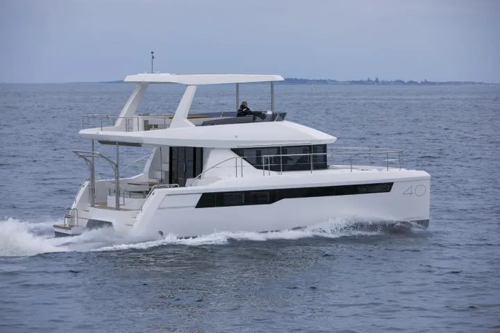 Slide: The Image of Manufacturer Provided Image: 2025 Leopard 40 Powercat cruising on open water, showcasing sleek design and modern features. - 3