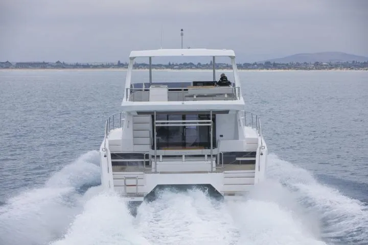 Slide: The Image of Manufacturer Provided Image: 2025 Leopard 40 Powercat cruising on open water, rear view. - 4