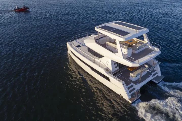 Slide: The Image of Manufacturer Provided Image: 2025 Leopard 40 Powercat cruising on open water, showcasing modern design and spacious decks. - 7