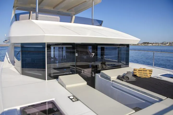 Slide: The Image of Manufacturer Provided Image: 2025 Leopard 40 Powercat yacht with sleek design and spacious deck on calm waters. - 8