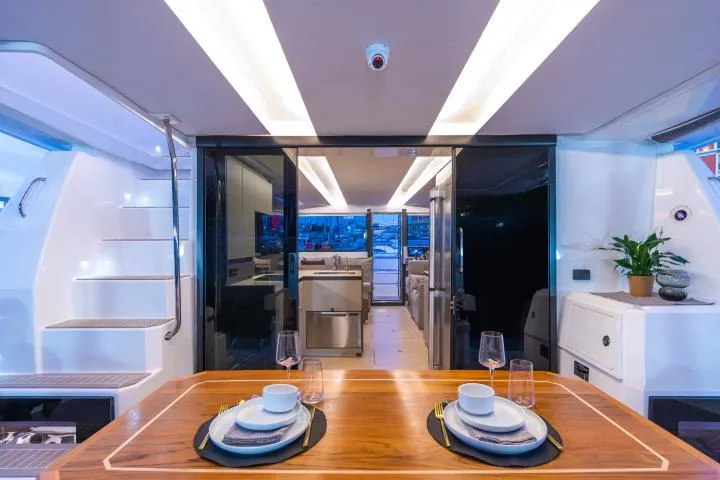 Slide: The Image of Manufacturer Provided Image: Luxurious interior of 2025 Leopard 40 Powercat yacht with elegant dining setup. - 9