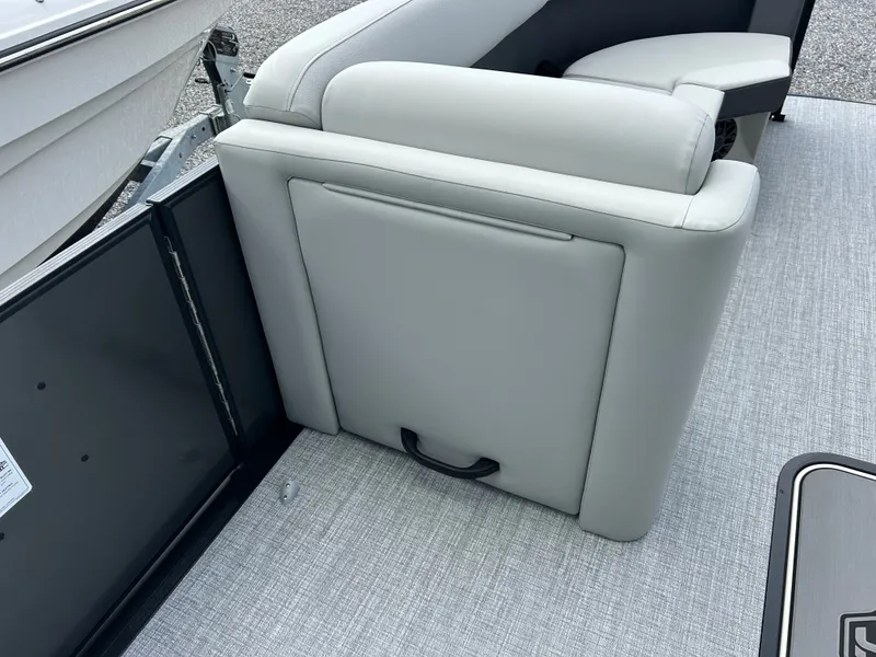 Slide: The Image of The image shows a gray seat on a boat with carpeted flooring. - 14