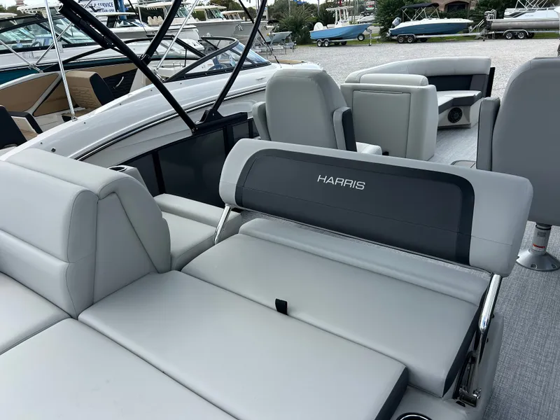 Slide: The Image of The image shows the interior of a 2027 Harris Cruiser 230 with gray upholstered seating. - 10