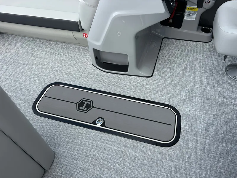 Slide: The Image of The image shows the floor of a 2027 Harris Cruiser 230 with a storage hatch. - 15