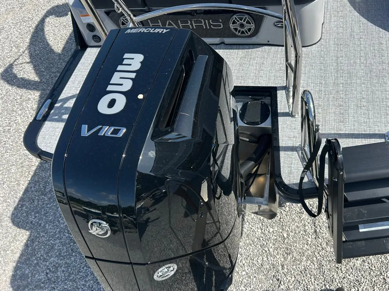 Slide: The Image of A Mercury 350 V10 outboard motor is mounted on a Harris Grand Mariner 250 boat. - 11