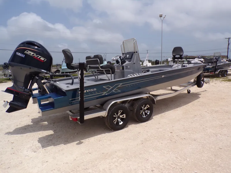 Slide: The Image of 2026 Xpress SW22B boat with Yamaha engine on trailer. - 10