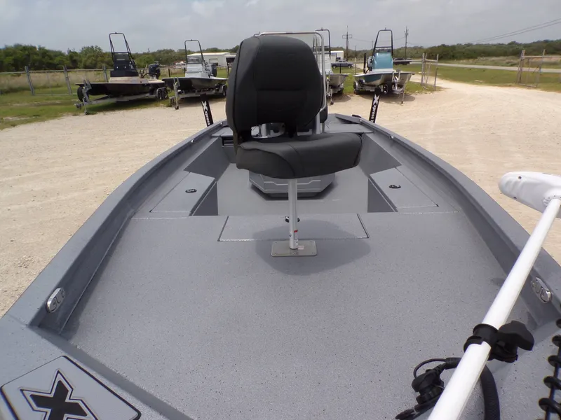 Slide: The Image of 2026 Xpress SW22B boat with seat on deck, in an outdoor lot. - 15