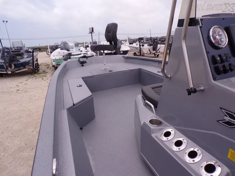 Slide: The Image of 2026 Xpress SW22B boat outdoors on a parking lot. - 6