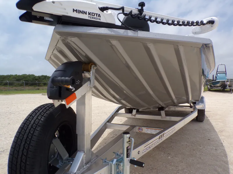Slide: The Image of Xpress SW22B 2026 boat on trailer with Minn Kota Terrova motor. - 8