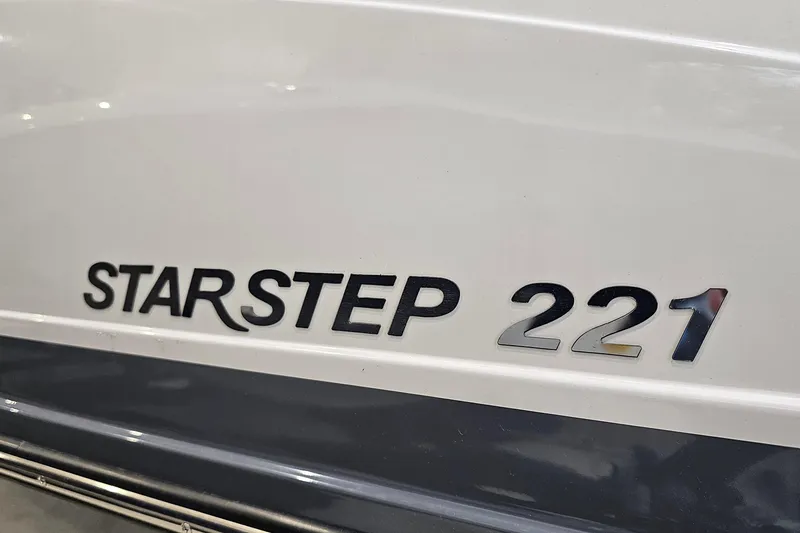 Slide: The Image of 2022 Starcraft Star Step 221 E I/O boat model nameplate on hull. - 20