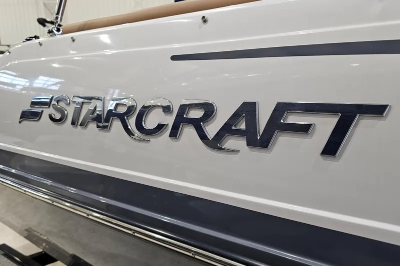 Slide: The Image of 2022 Starcraft Star Step 221 E I/O boat logo on white hull. - 21