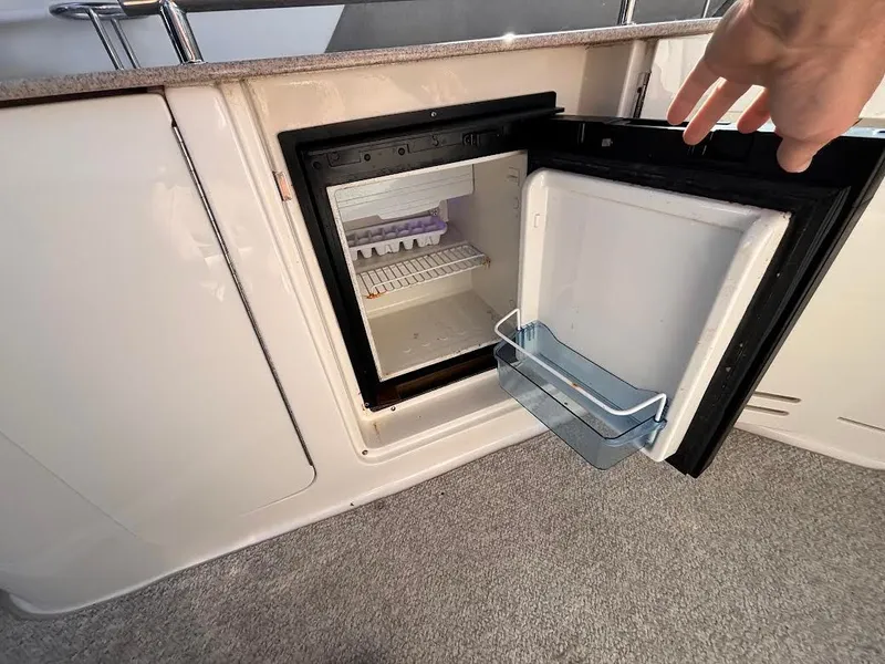 Slide: The Image of Open fridge on a 2007 Sea Ray Sundancer 310 yacht. - 11