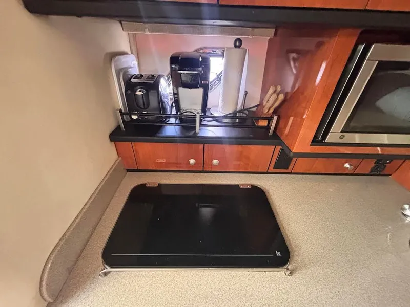 Slide: The Image of Kitchen area of 2007 Sea Ray Sundancer 310 yacht. - 18