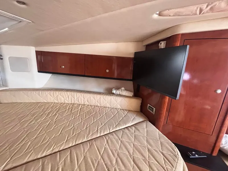 Slide: The Image of Interior of 2007 Sea Ray Sundancer 310 yacht with bed and TV. - 19