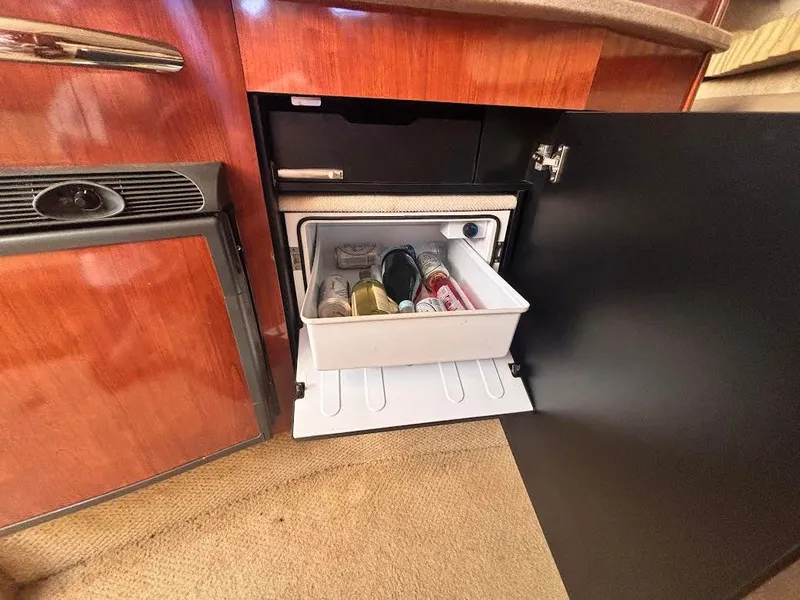 Slide: The Image of Refrigerator in Sea Ray Sundancer 310 boat, stocked with beverages. - 22