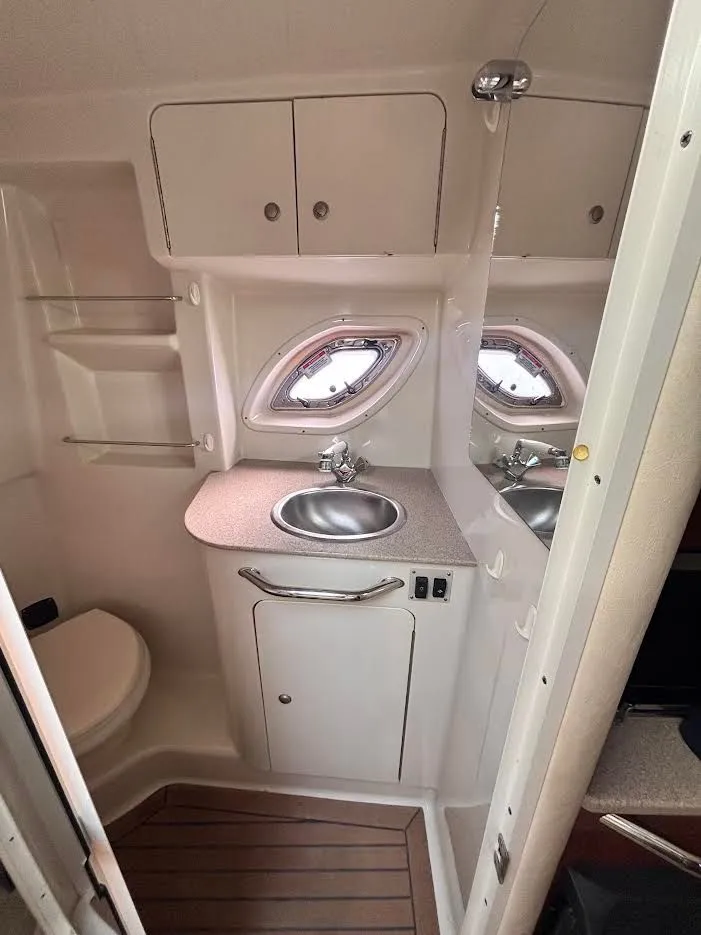 Slide: The Image of Interior of Sea Ray Sundancer 310 yacht, bathroom with sink and toilet. - 23