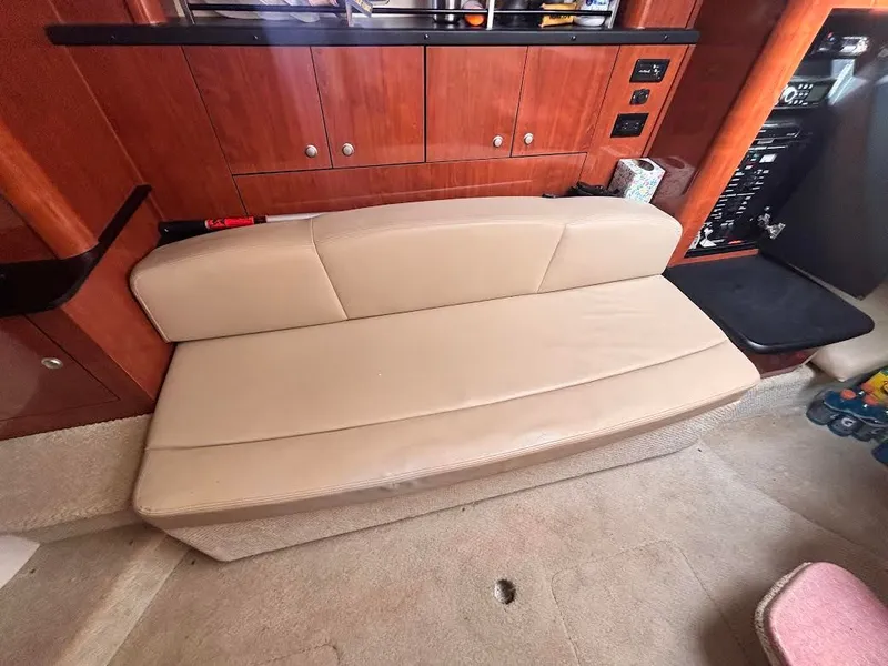 Slide: The Image of Interior of 2007 Sea Ray Sundancer 310 yacht, leather sofa, wooden cabinetry. - 27