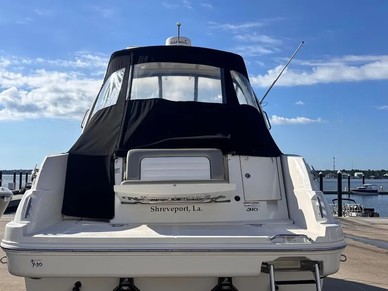 Slide: The Image of 2007 Sea Ray Sundancer 310 at dock with black canopy. - 3