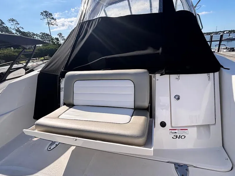 Slide: The Image of 2007 Sea Ray Sundancer 310 with bench seating and black canopy. - 4