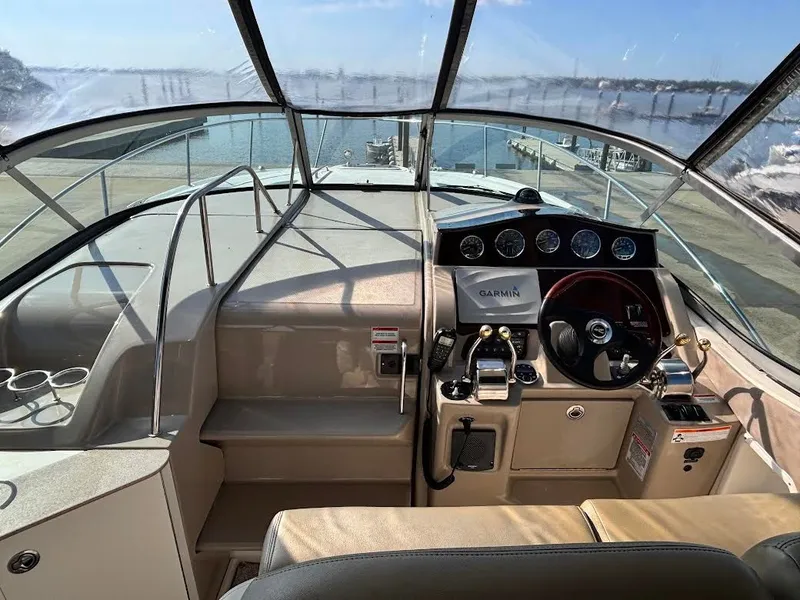 Slide: The Image of Interior view of 2007 Sea Ray Sundancer 310 cockpit with Garmin system. - 7