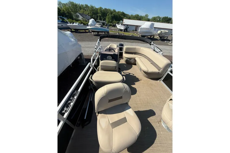 Slide: The Image of 2021 Sun Tracker Bass Buggy 16 XL Select pontoon boat interior with beige seating. - 12