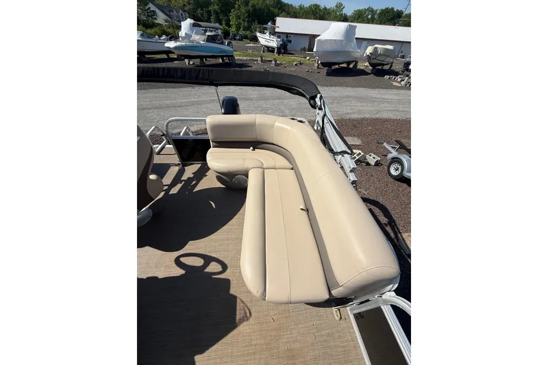 Slide: The Image of 2021 Sun Tracker Bass Buggy 16 XL Select pontoon boat with beige seating. - 14