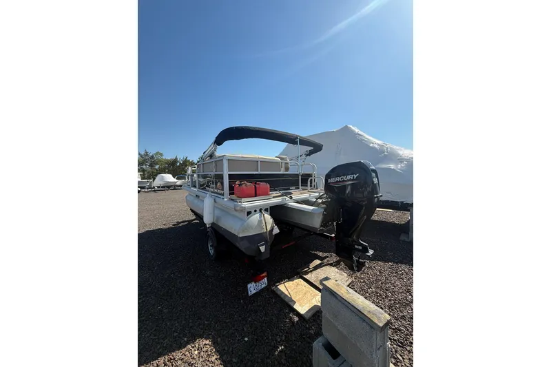 Slide: The Image of 2021 Sun Tracker Bass Buggy 16 XL Select pontoon boat with Mercury outboard motor. - 5