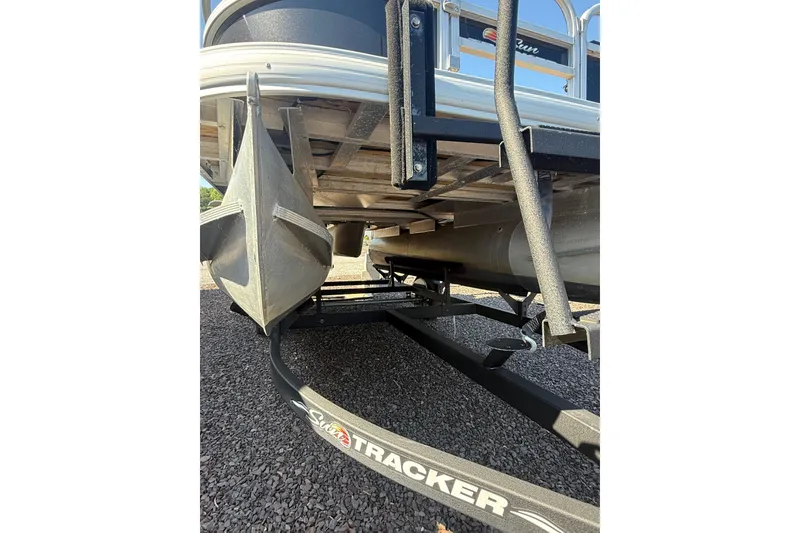 Slide: The Image of 2021 Sun Tracker Bass Buggy 16 XL Select pontoon boat on trailer, underside view. - 9