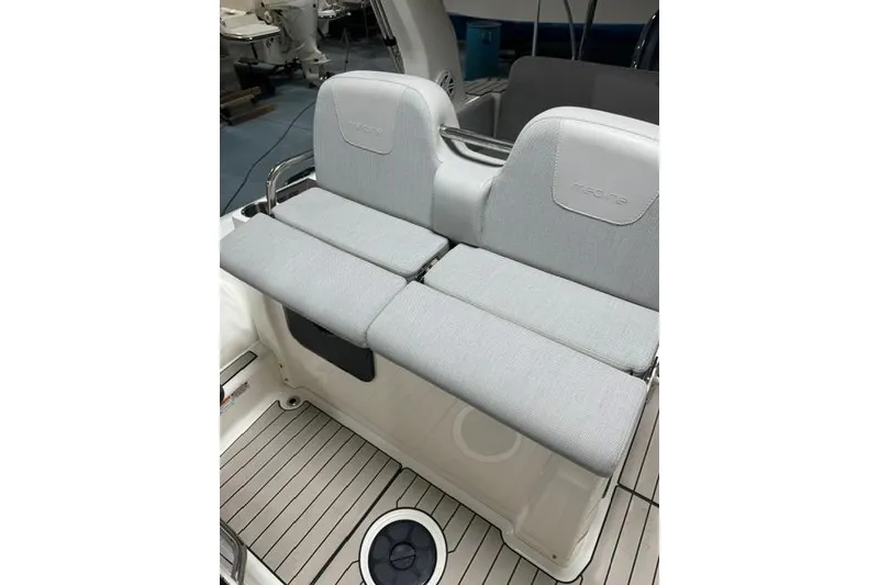 Slide: The Image of 2025 Zodiac Medline 7.5 boat seating with light gray cushions and sleek design. - 13