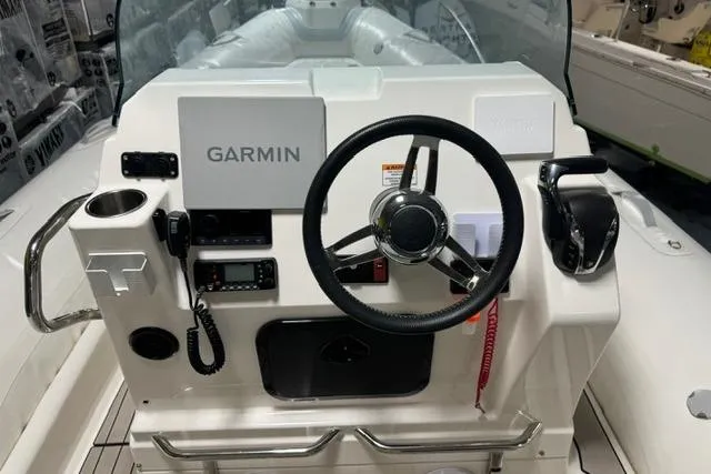 Slide: The Image of Cockpit of 2025 Zodiac Medline 7.5 boat with Garmin navigation system. - 6