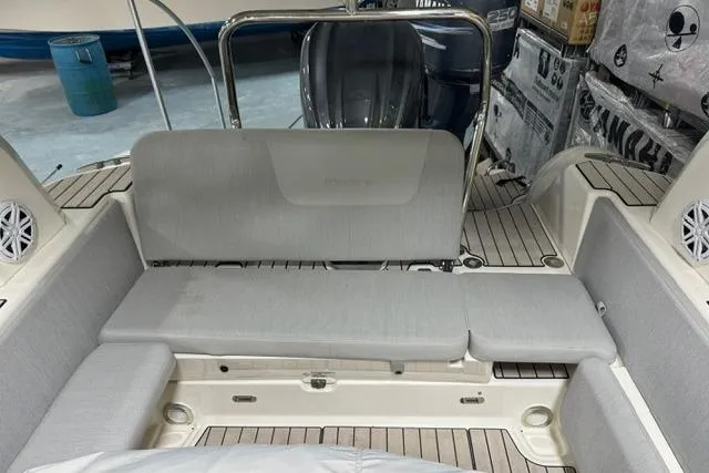 Slide: The Image of 2025 Zodiac Medline 7.5 boat interior with gray seating and teak flooring. - 9