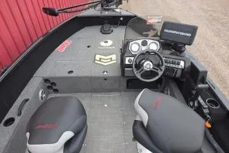 Slide: The Image of 2022 Alumacraft Competitor 165 SC boat interior with steering console and seating. - 10